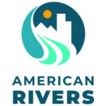 American Rivers icon in various shades of blue depicting a river, white mountains and an urban building under a yellow sun.