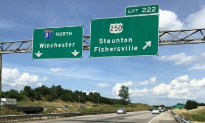 Northbound I-81 signs at Exit 222 on a sunny day.
