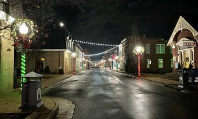 Night main-street light up with holiday lights.