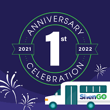 One-year anniversary logo with fireworks and a graphic image of the ShenGo bus.